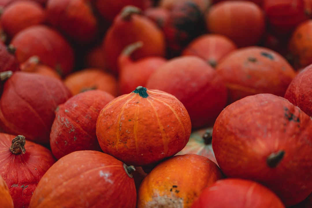 orange pumpkin on brown wooden table