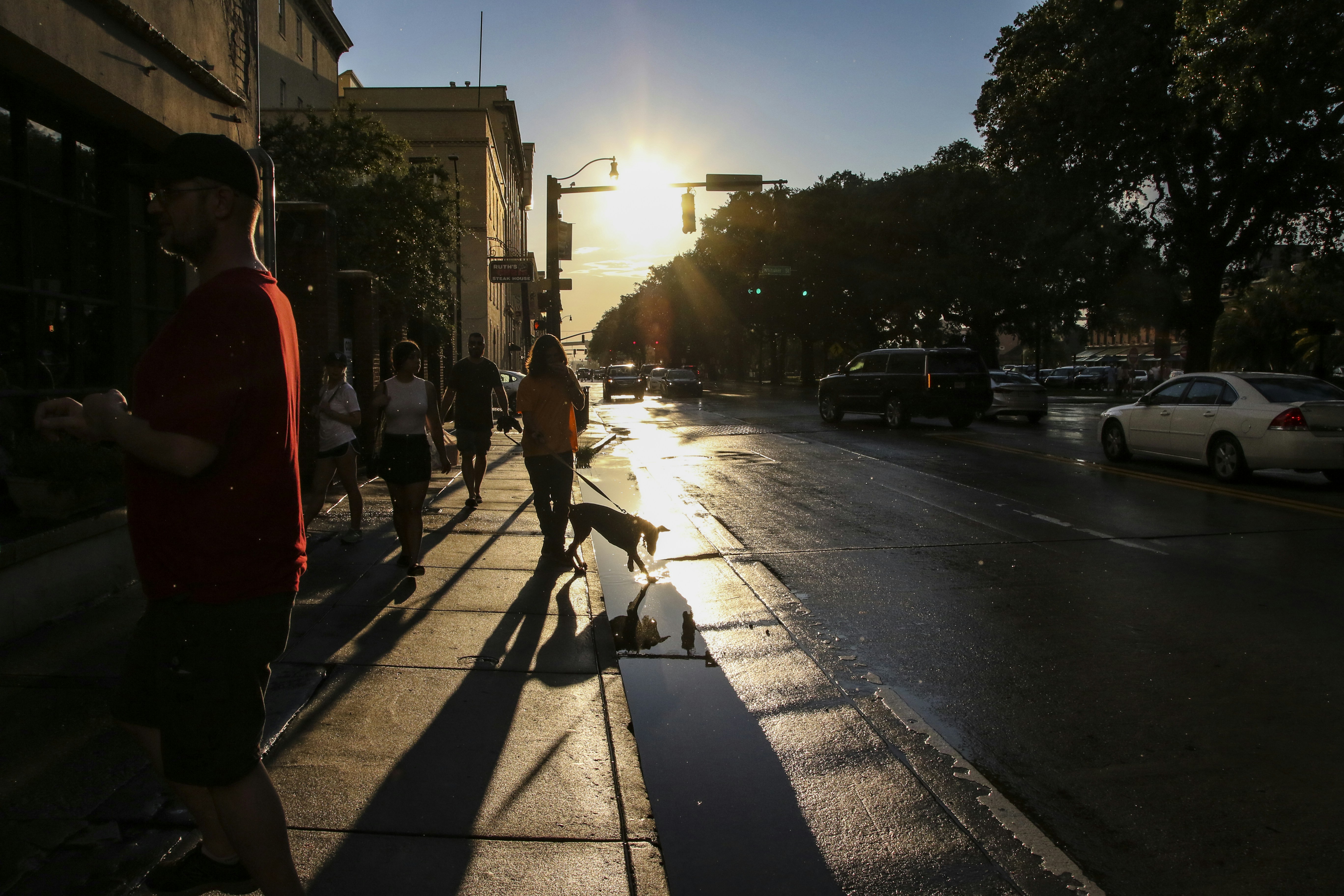 People walking on sidewalk during daytime - historic districts