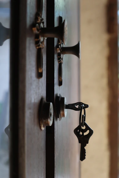 Close-up of a sleek juandun electromagnetic lock installed on a glass door in a modern office.