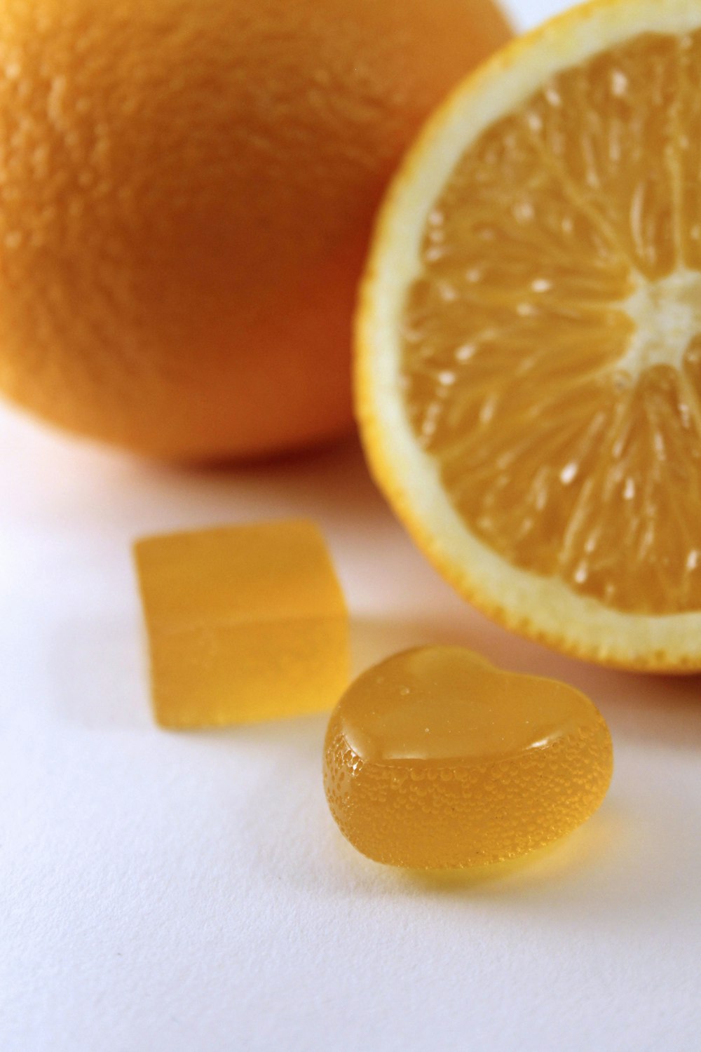 sliced orange fruit on white surface