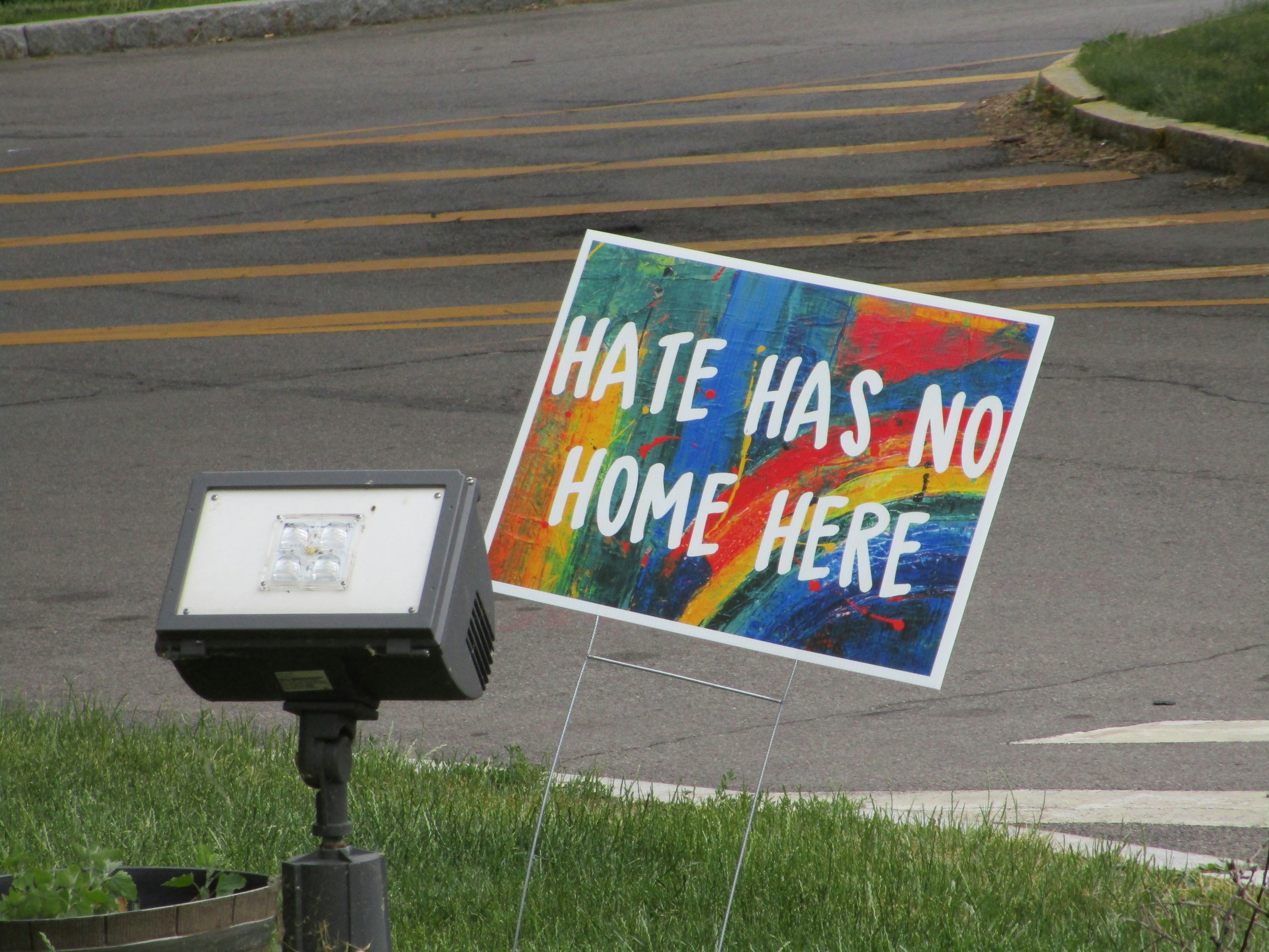 white and blue road sign