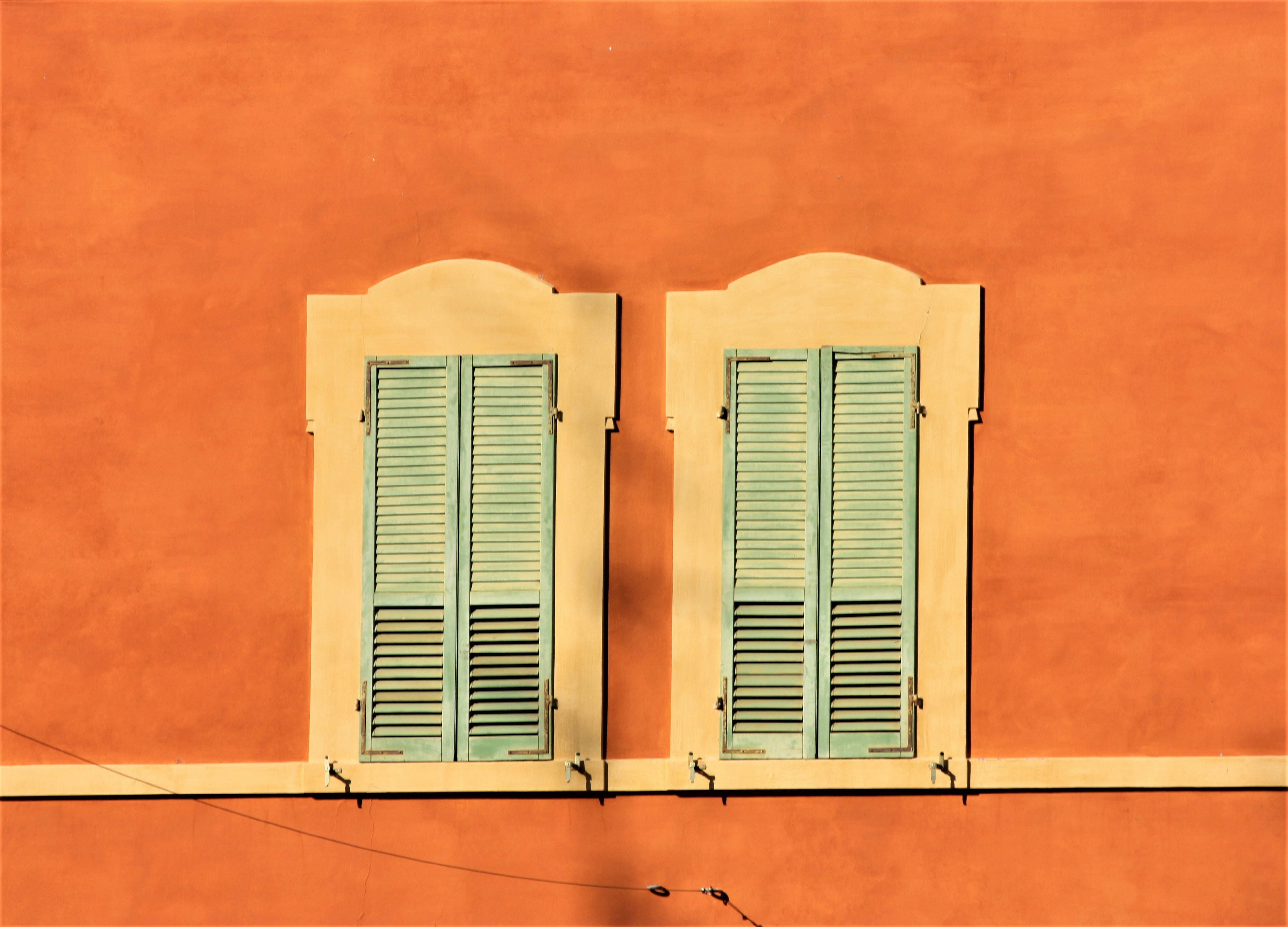 white wooden window on orange wall