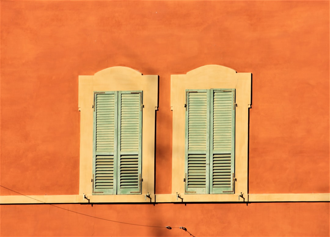 white wooden window on orange wall