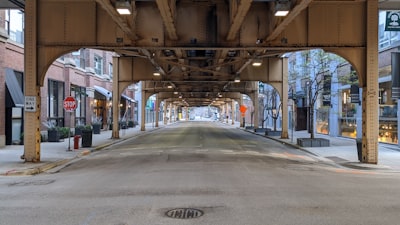empty road in between buildings during daytime elevated google meet background