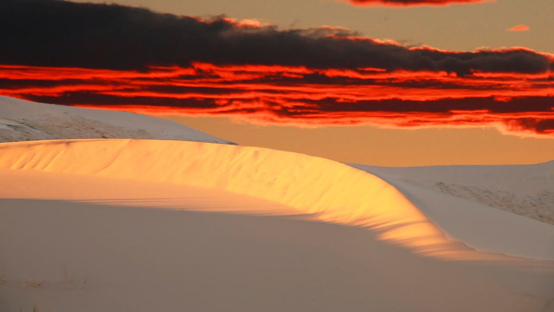 white clouds over the sea during sunset