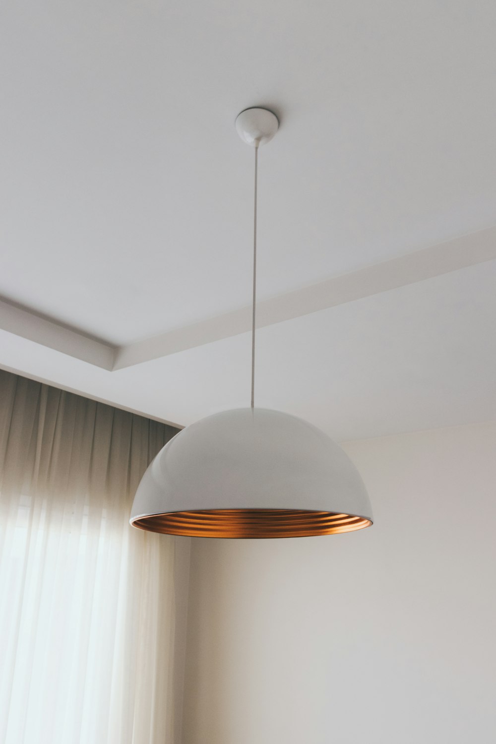 white and brown pendant lamp