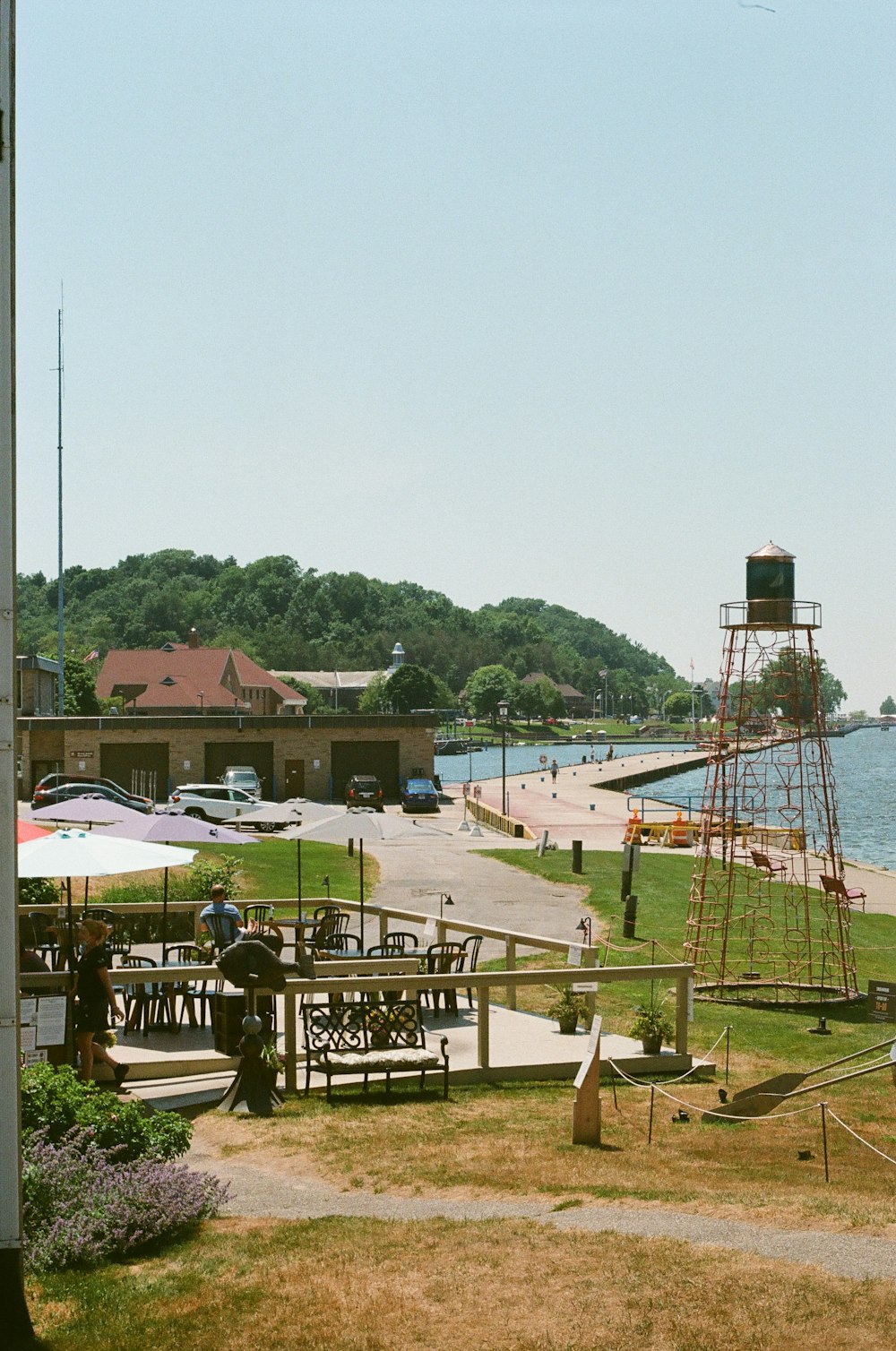 brown and white concrete building near body of water during daytime