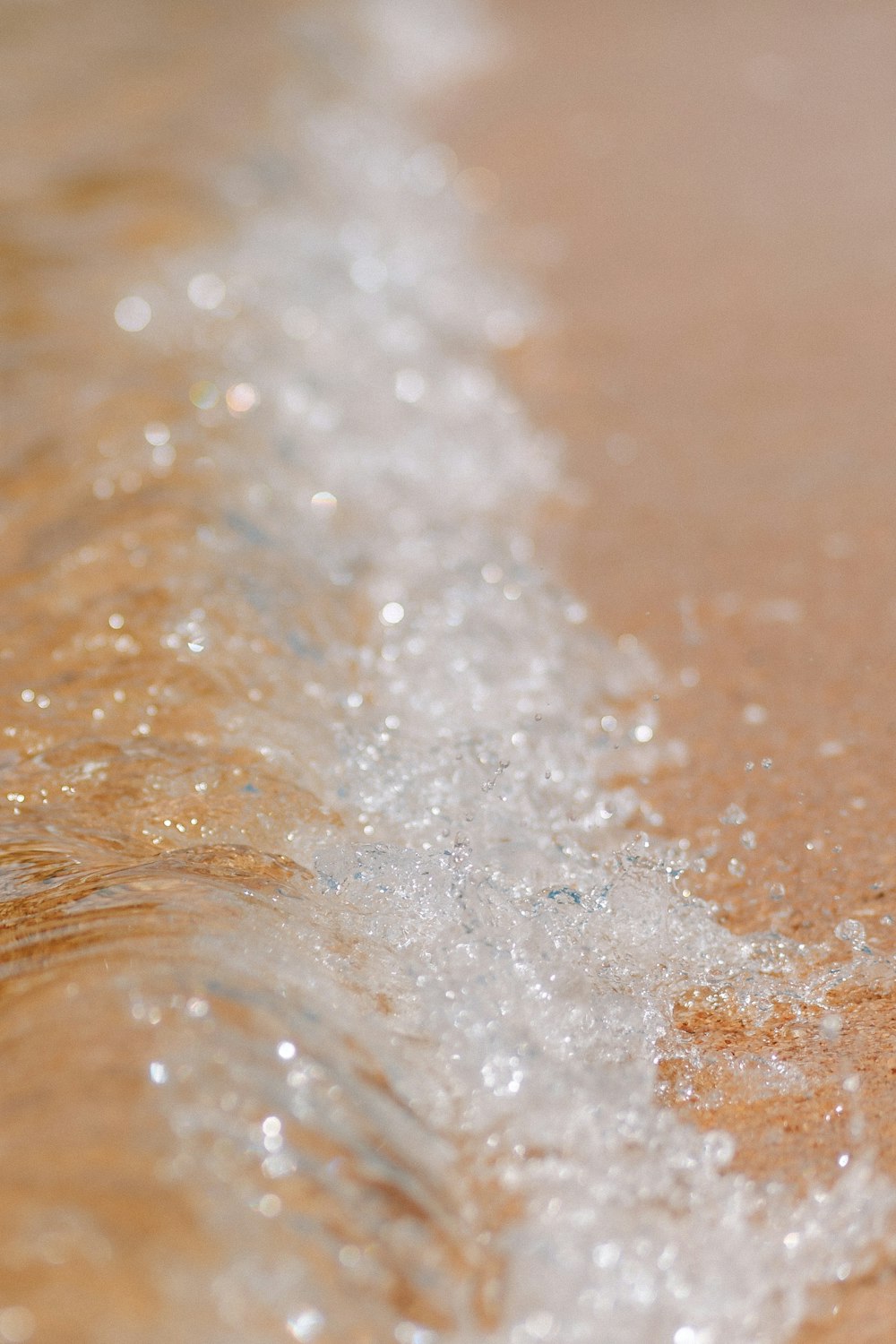 water splash on brown wooden surface