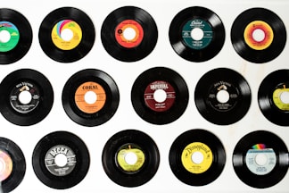 a collection of various records on a wall