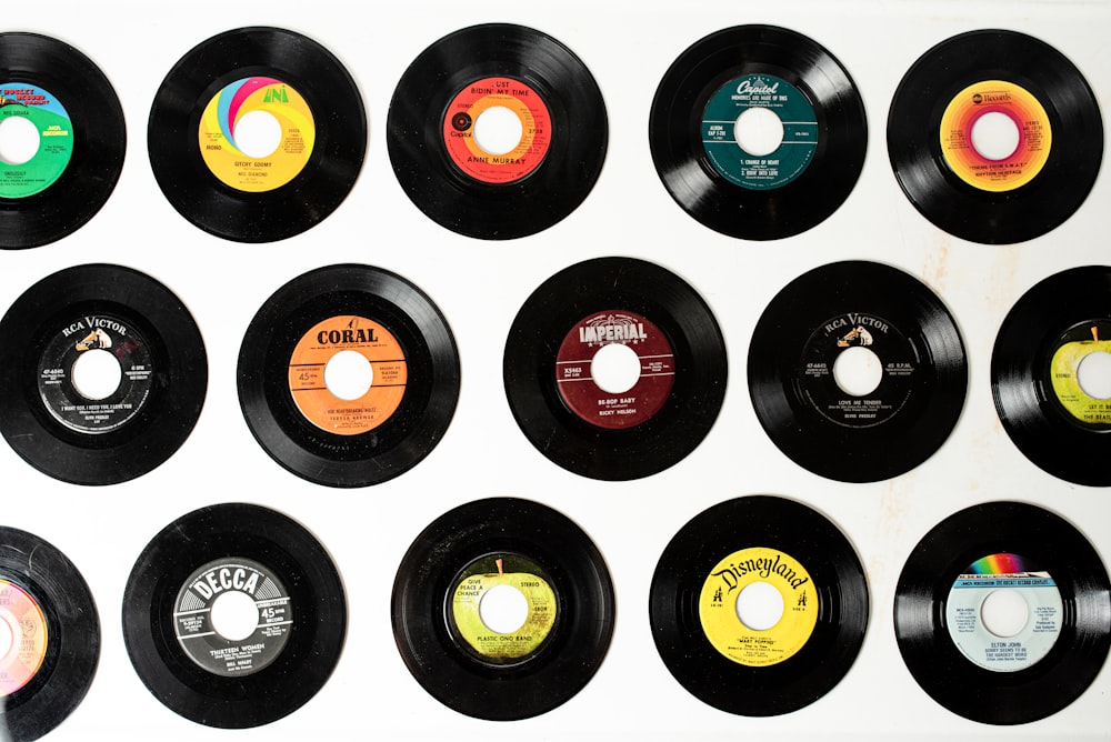a collection of various records on a wall