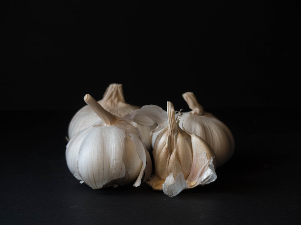 white garlic on black surface