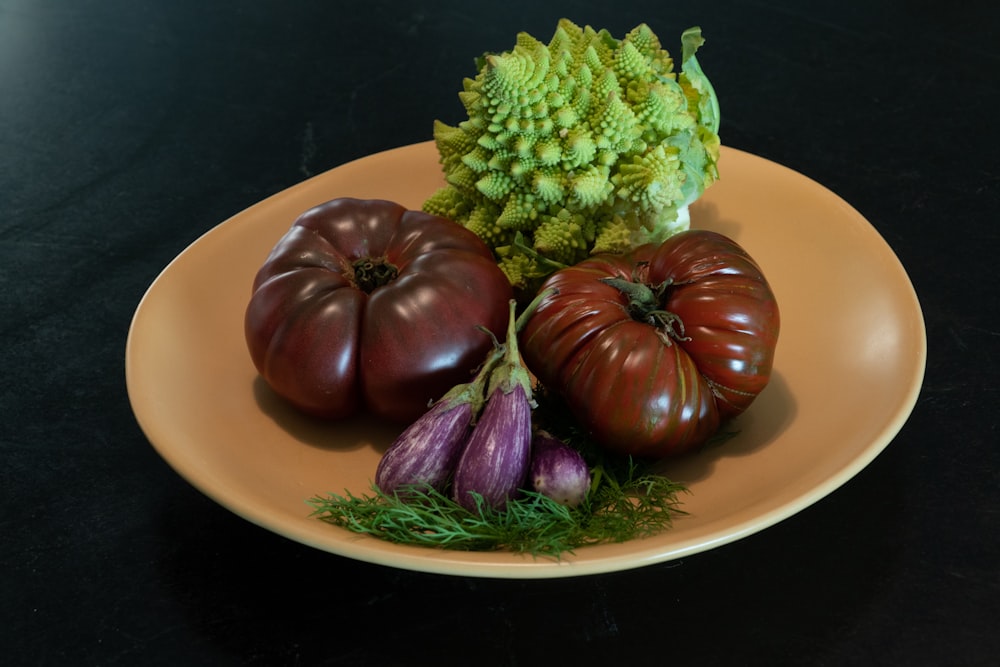 green and purple vegetable on white ceramic plate