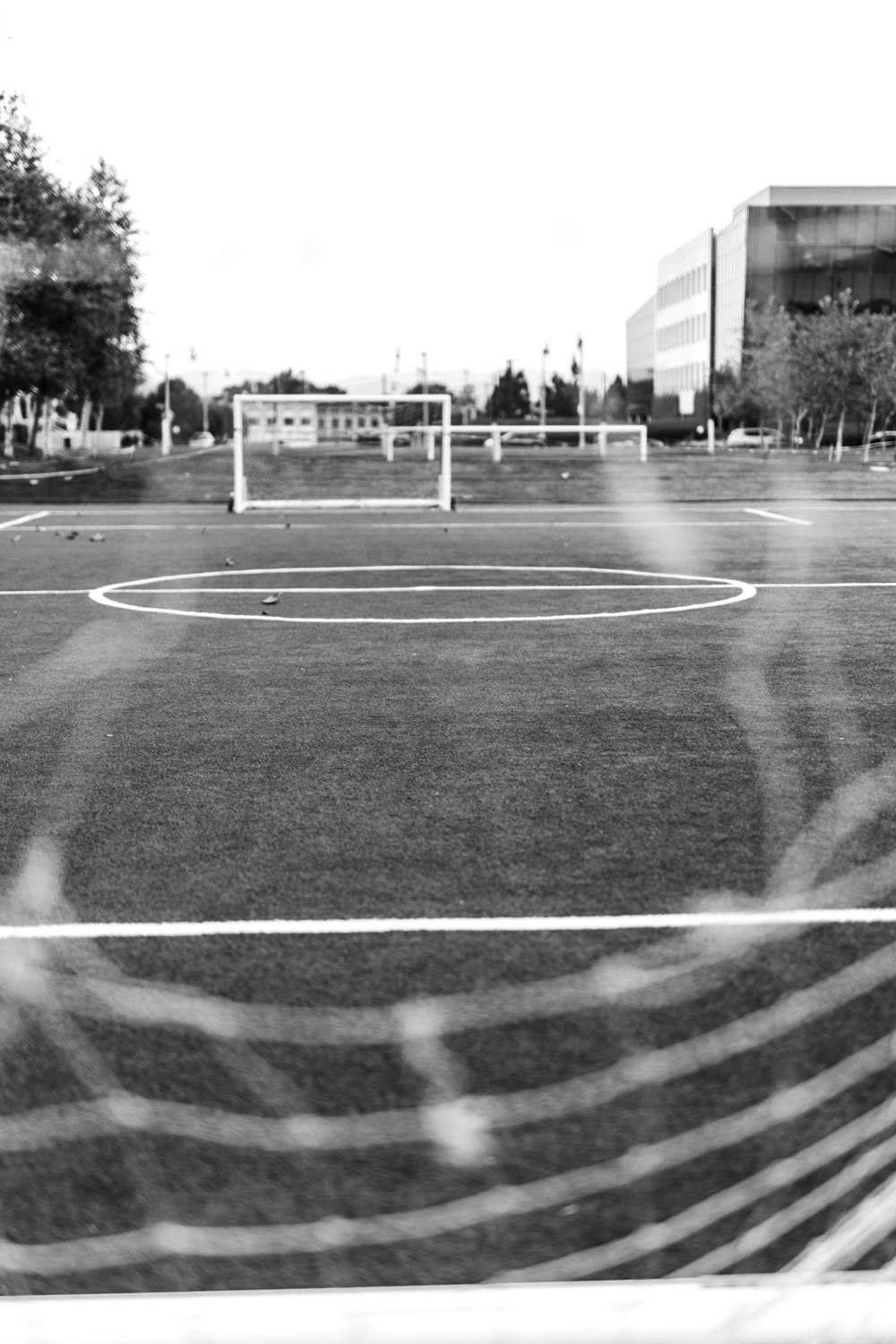 grayscale photo of basketball court