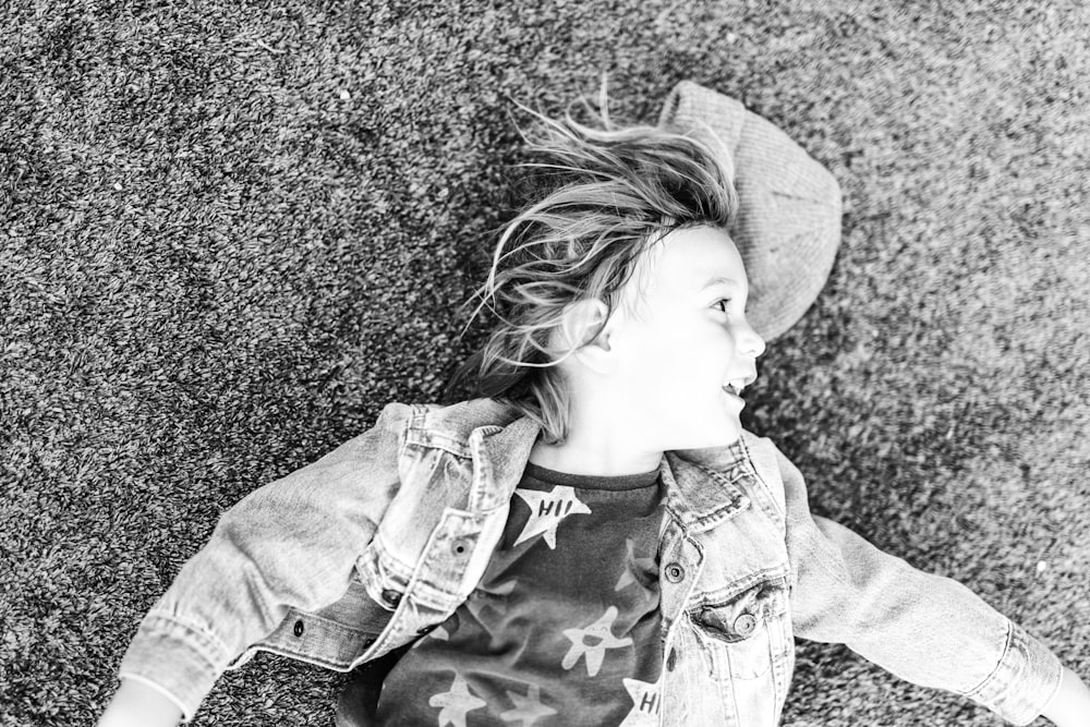 grayscale photo of girl in long sleeve shirt