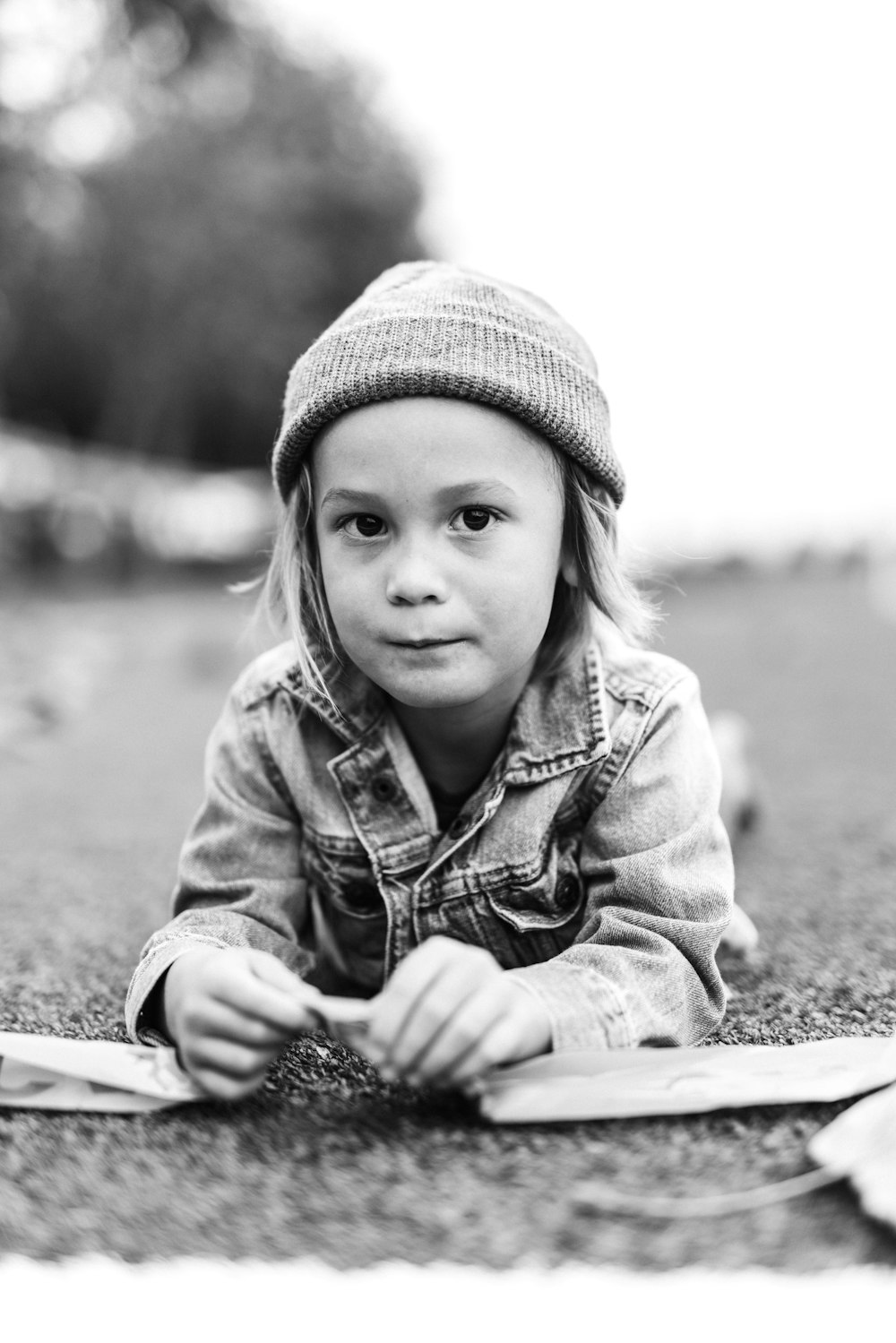 grayscale photo of girl wearing knit cap and jacket