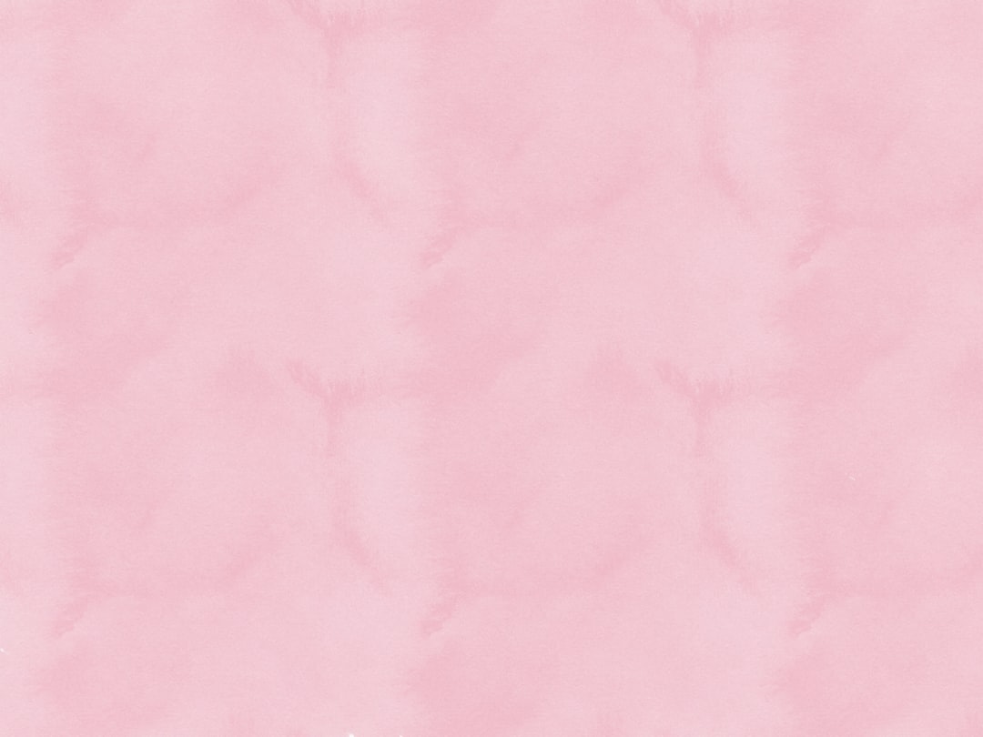 pink textile on brown wooden table