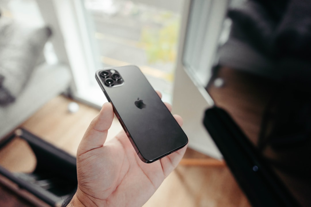 person holding black iphone 7, iPhone 12 Pro | Graphite