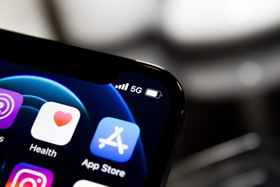 black iphone 4 displaying icons