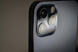 black and gray speaker on white table