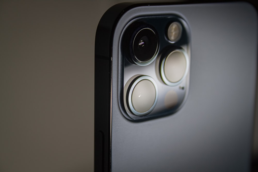 black and gray speaker on white table