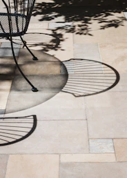 black metal round table on gray concrete floor