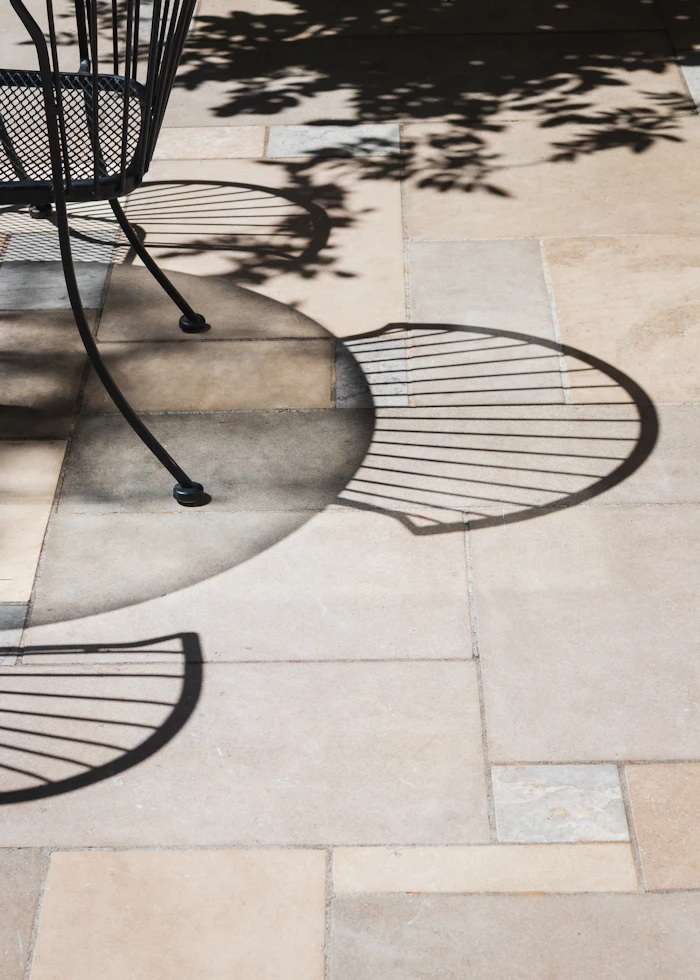 Large format concrete paver patio rectilinear soldier course border running bond