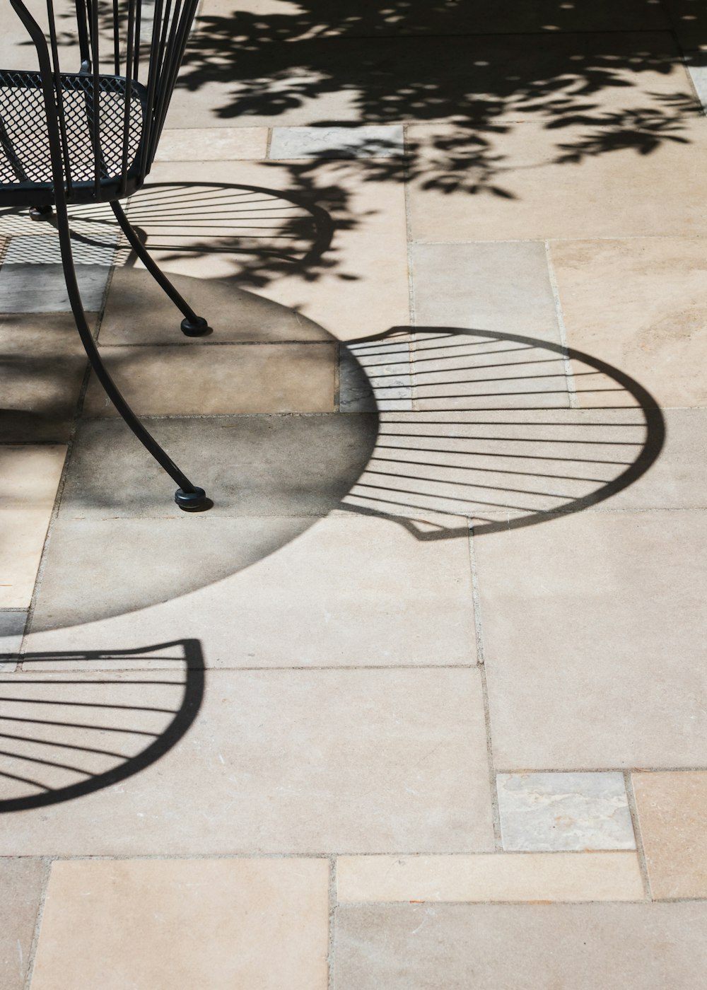 black metal round table on gray concrete floor