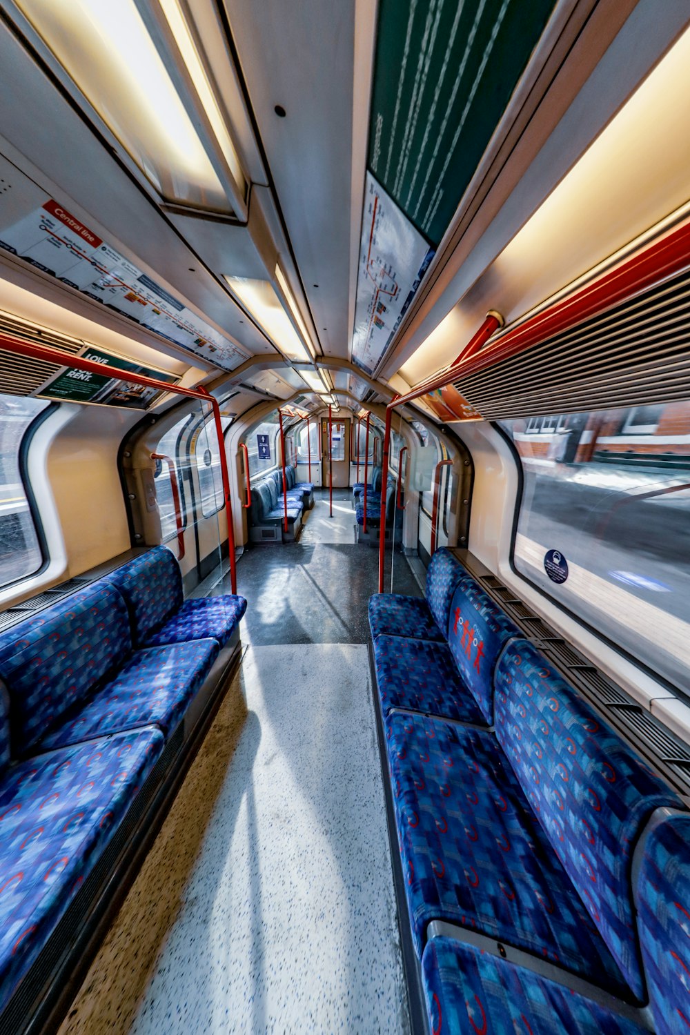 blue and red train in a train station