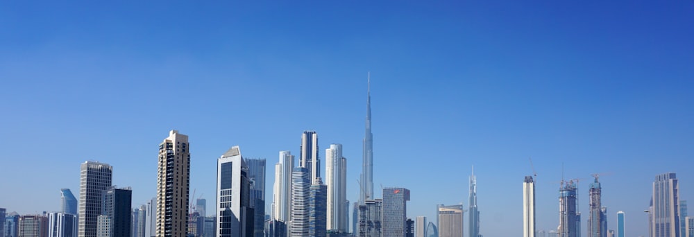 city skyline under blue sky during daytime