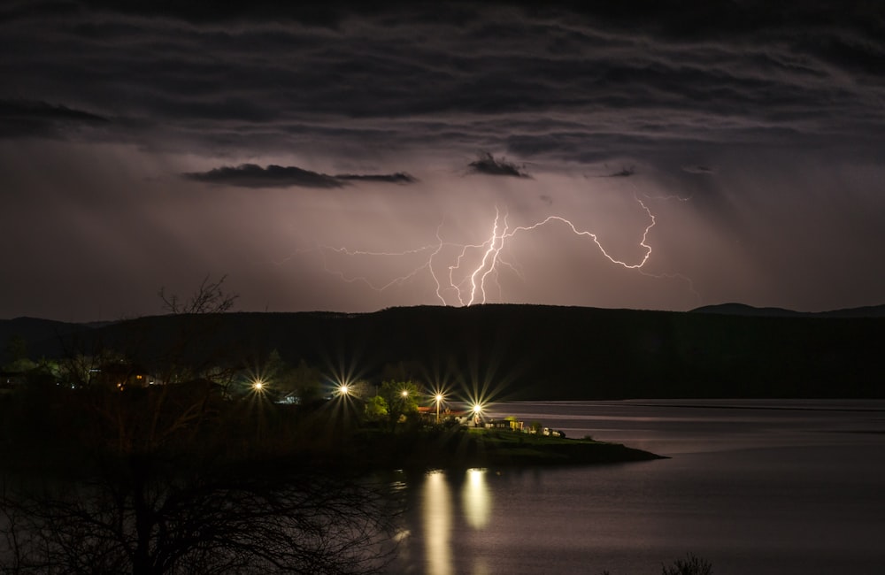 lightning over lake and trees