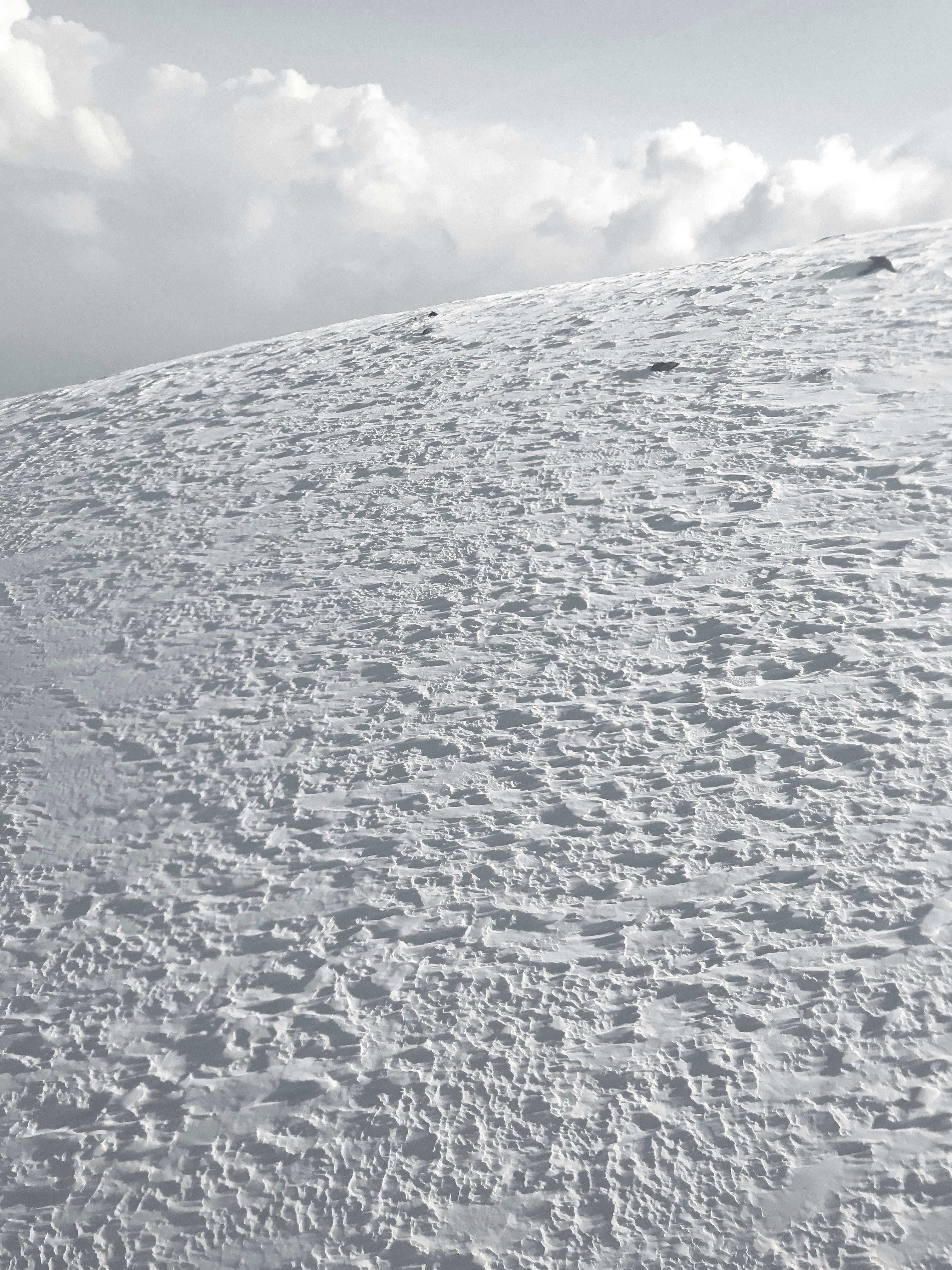 white snow covered mountain under white clouds during daytime