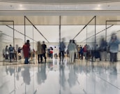 A diverse group of people enjoying shopping together in a modern retail environment.