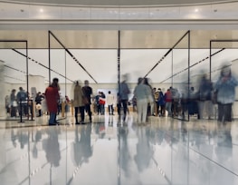 A diverse group of people enjoying shopping together in a modern retail environment.