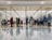 A diverse group of people happily shopping together in a modern retail environment.