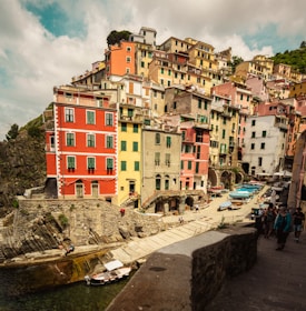 Coastal view of a charming French village with pastel buildings overlooking the Mediterranean sea.