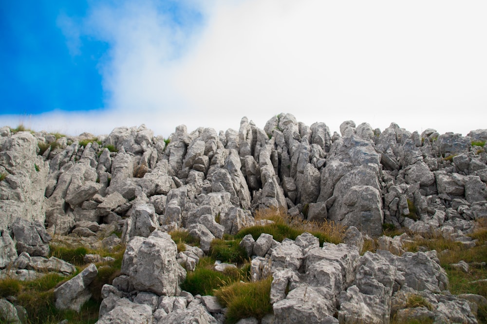 gray rocky mountain under blue sky during daytime