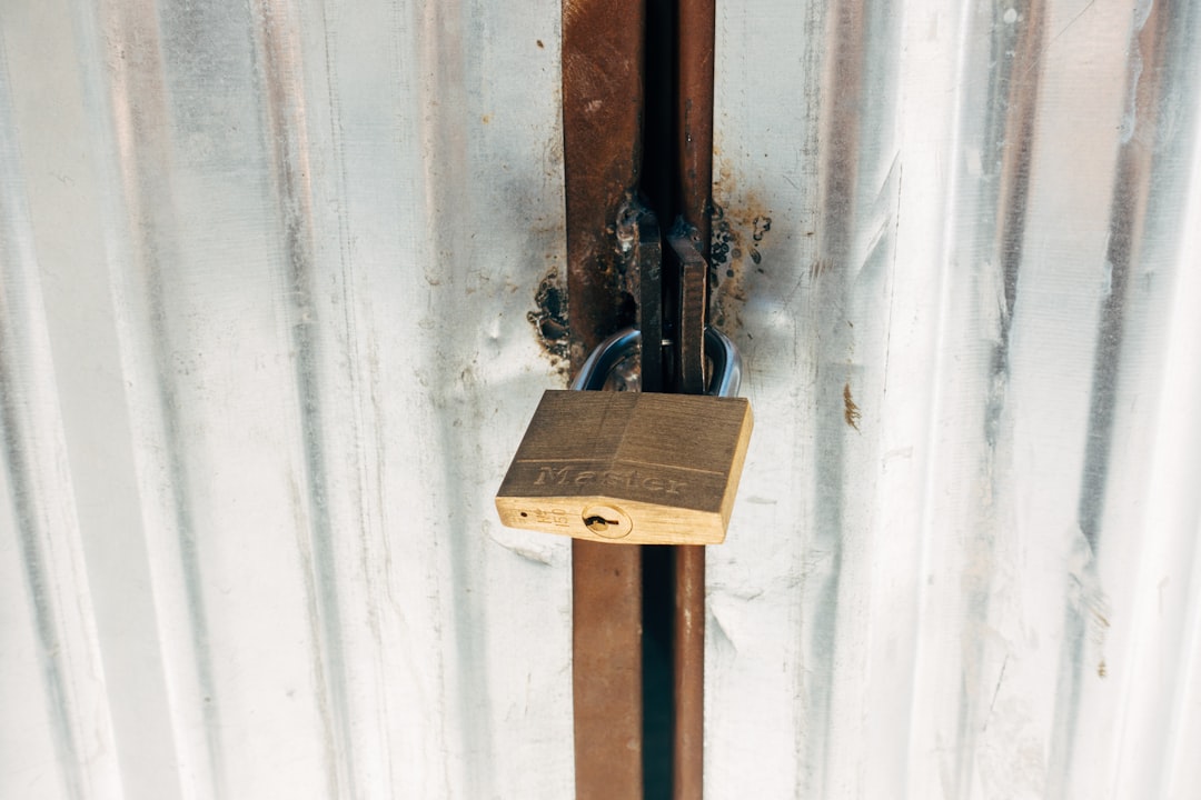 brown wooden cross with padlock