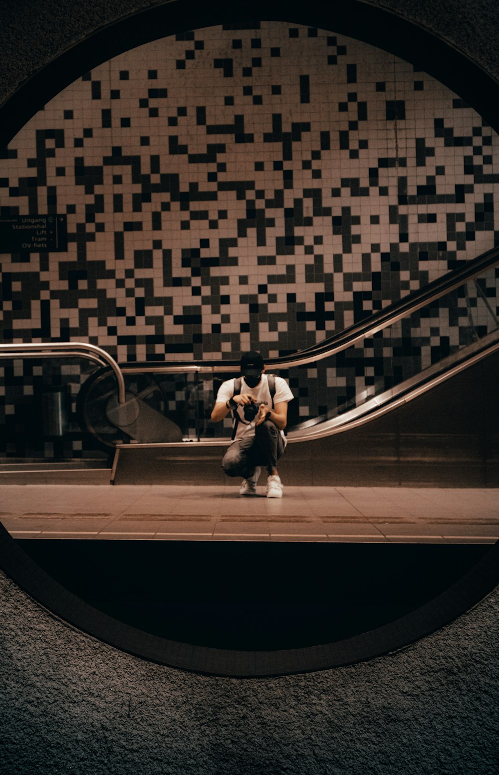 2 women sitting on black and white staircase