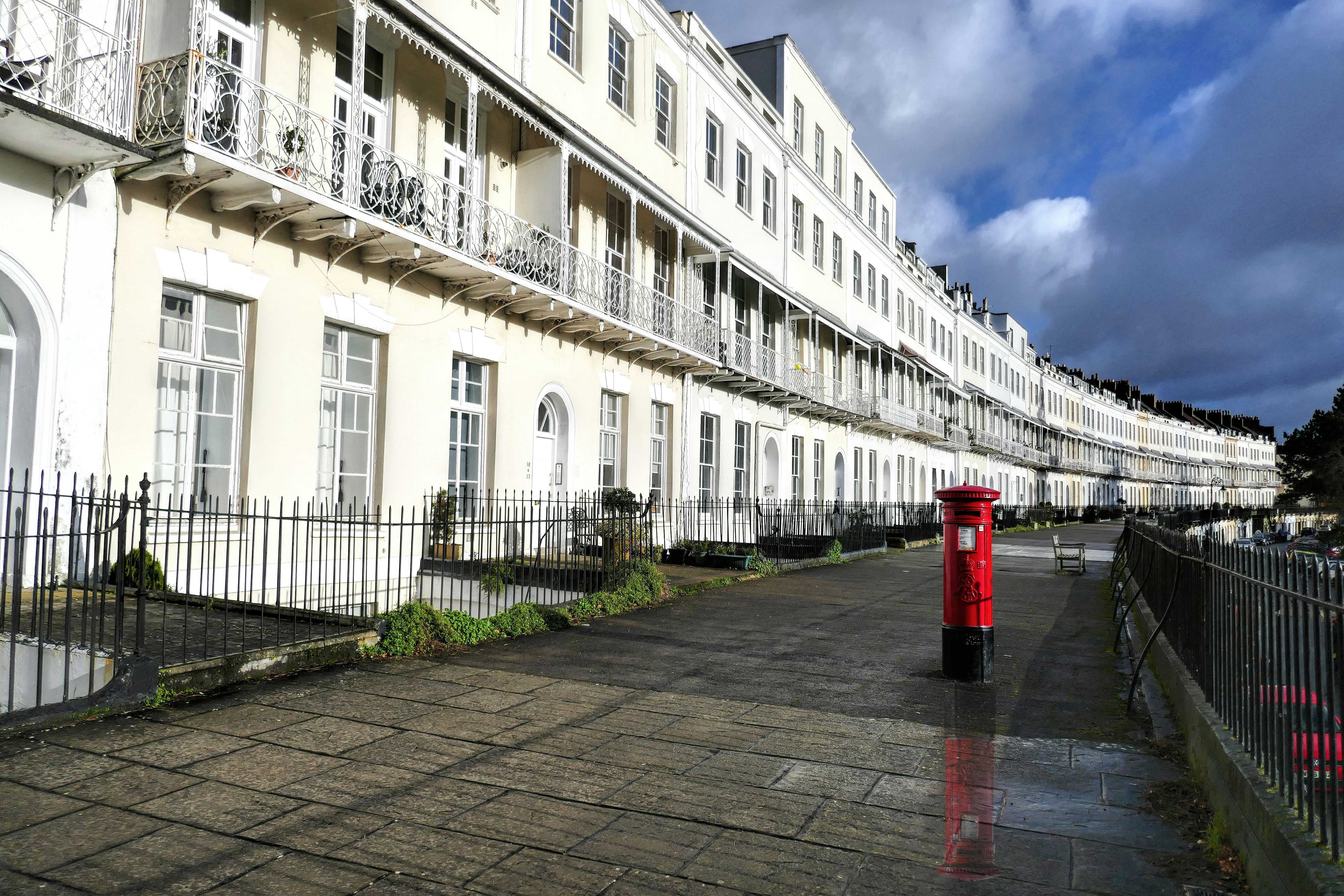 red fire hydrant near white concrete building during daytime pictorial teams background