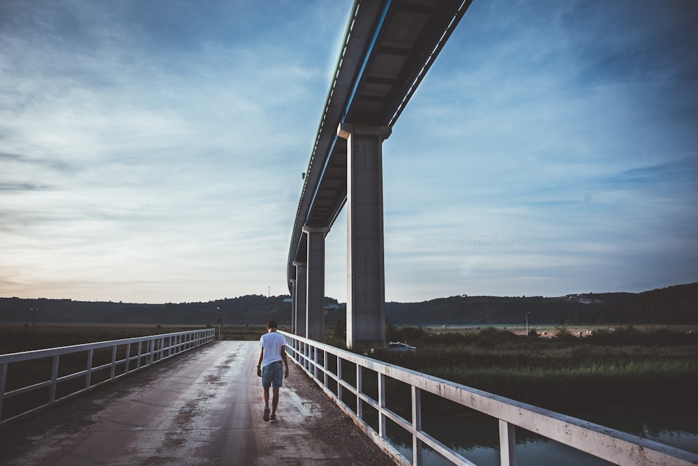 people walking on bridge during daytime