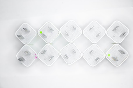Variety of colorful plugs arranged neatly on a white background