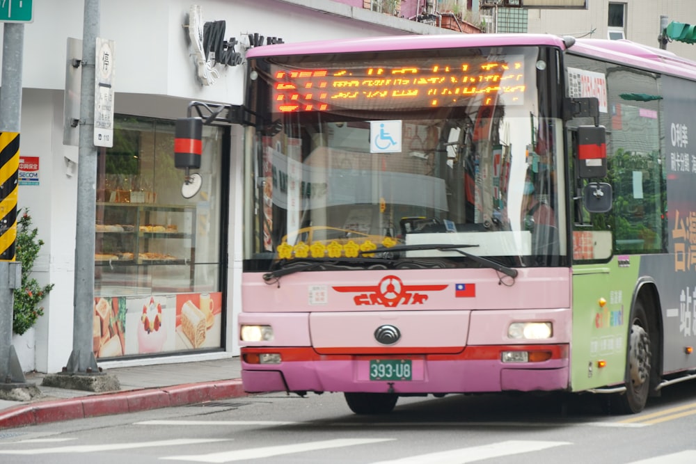 red and white bus on road during daytime