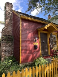 A sold sign in front of a charming house on a sunny day.