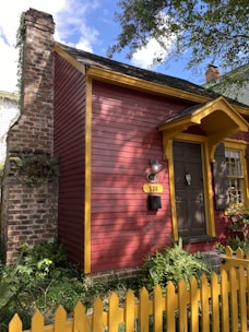 A sold sign in front of a charming house on a sunny day.
