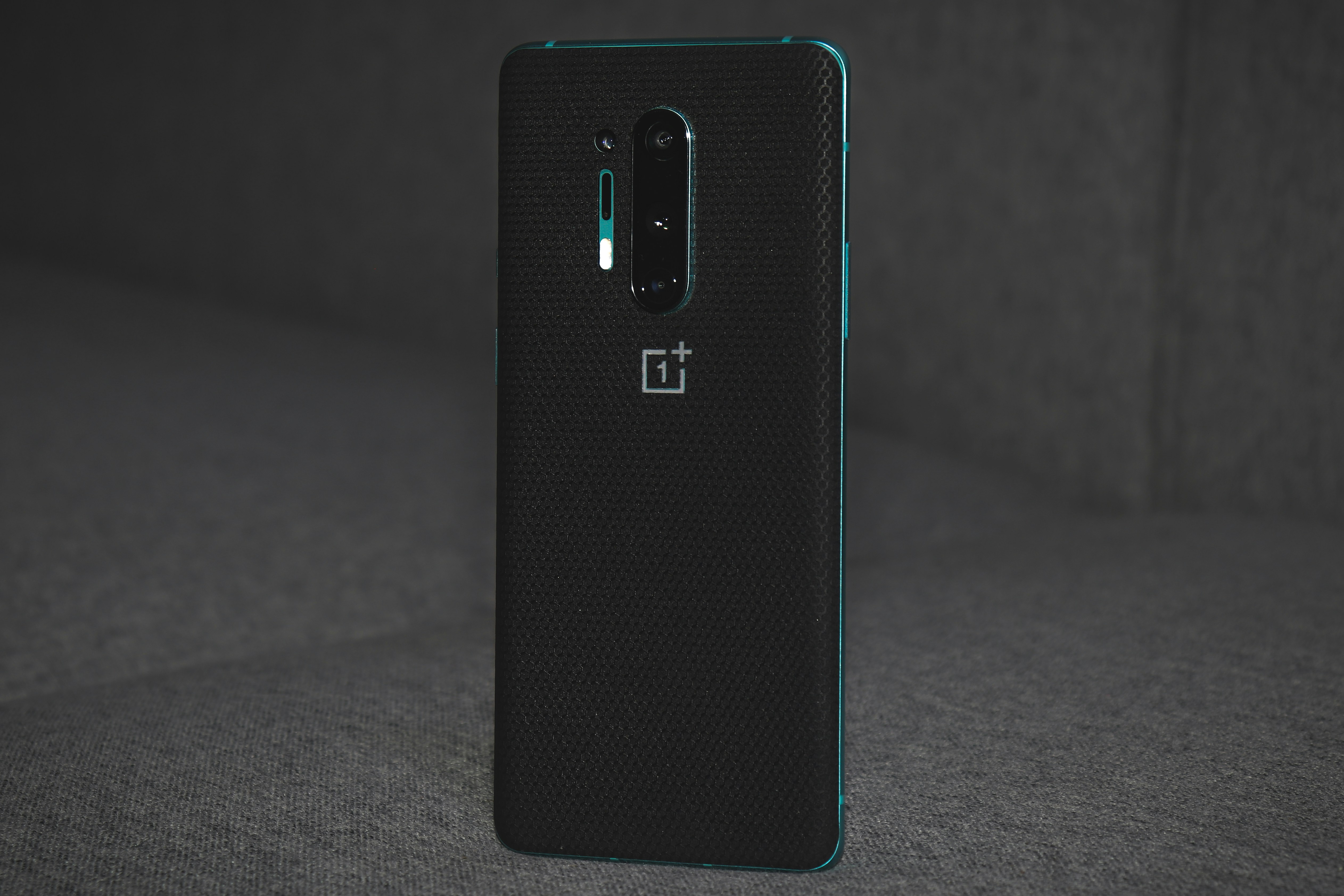 OnePlus smartphone in black on dark background