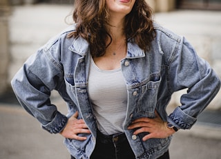 woman in blue denim jacket smiling