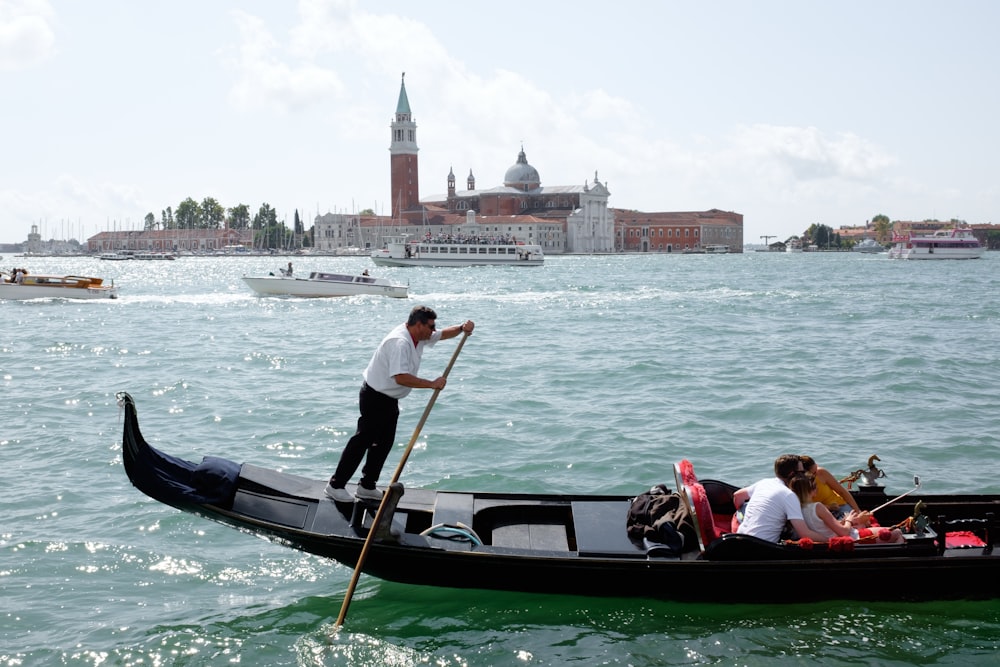 people riding on boat on river during daytime