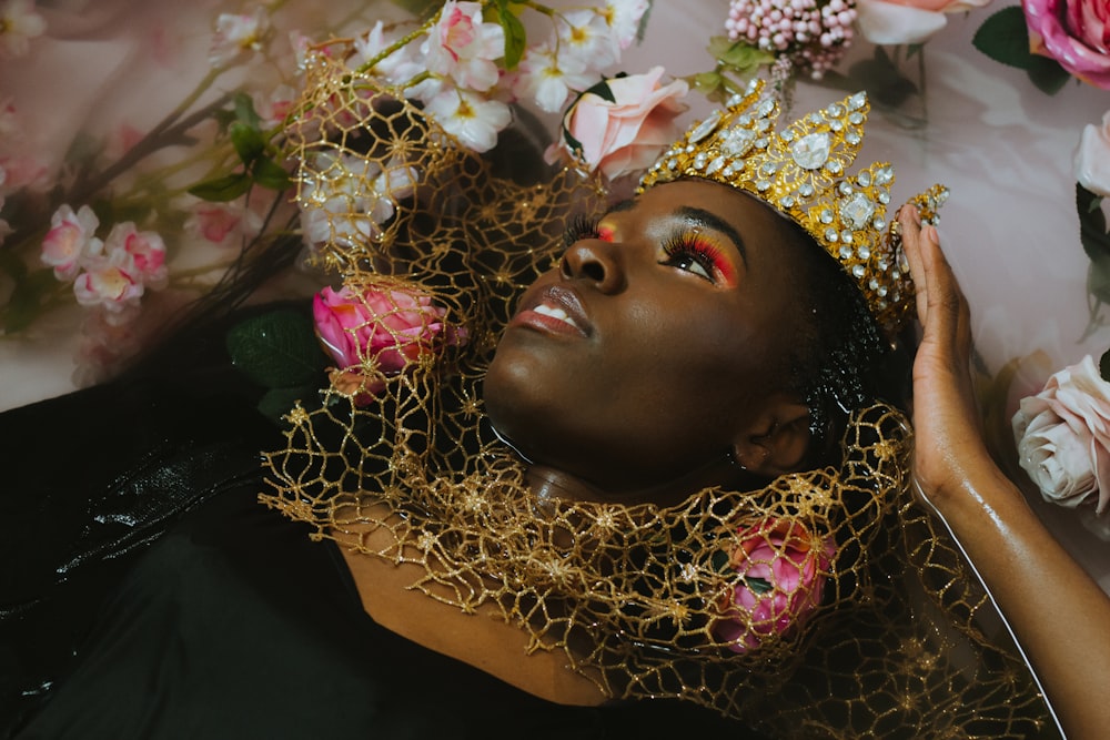 woman in gold and white floral head dress