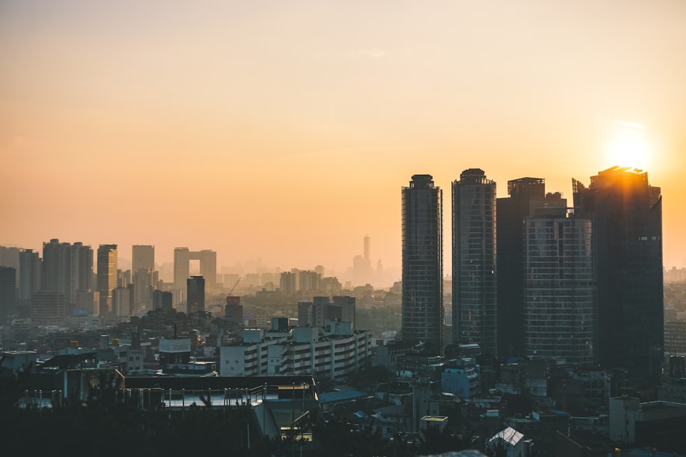 city skyline during orange sunset