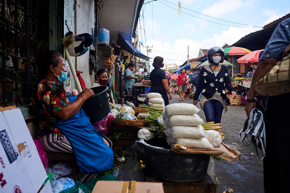 people standing near food stall during daytime